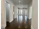 Hallway view of open-concept home, hardwood floors, and neutral color palette at 906 Winall Down Ne Rd, Atlanta, GA 30319
