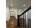 Hallway featuring gleaming hardwood floors, white walls and trim at 906 Winall Down Ne Rd, Atlanta, GA 30319