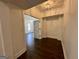 Inviting hallway with hardwood floors, white trim, and decorative ceiling light at 906 Winall Down Ne Rd, Atlanta, GA 30319