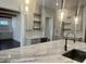 Spacious kitchen featuring a marble island countertop, pendant lights, and decorative tile backsplash at 906 Winall Down Ne Rd, Atlanta, GA 30319