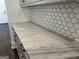 Kitchen counter with elegant marble countertops and decorative tile backsplash at 906 Winall Down Ne Rd, Atlanta, GA 30319