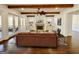 Cozy living room with a stone fireplace, built-in shelving, and hardwood floors at 906 Winall Down Ne Rd, Atlanta, GA 30319
