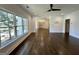 Bright living room with hardwood floors, modern lighting, and large windows offering natural light at 906 Winall Down Ne Rd, Atlanta, GA 30319