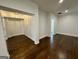 Open living room with beautiful hardwood floors, white trim, and ample space at 906 Winall Down Ne Rd, Atlanta, GA 30319