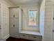 Mudroom with a built-in bench, storage cabinets, and window seat at 906 Winall Down Ne Rd, Atlanta, GA 30319