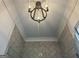 Contemporary shower featuring herringbone tile and a modern chandelier at 906 Winall Down Ne Rd, Atlanta, GA 30319