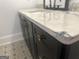 Close-up of a vanity with a light marble countertop and bronze hardware at 906 Winall Down Ne Rd, Atlanta, GA 30319