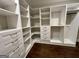 Spacious walk-in closet featuring custom white shelving, drawers, and ample storage space at 906 Winall Down Ne Rd, Atlanta, GA 30319