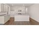 Bright kitchen featuring stainless steel appliances, granite countertops, and spacious island at 2761 Honey Locust Court, Loganville, GA 30052