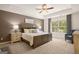 Spacious main bedroom with tray ceiling, ceiling fan, and a serene atmosphere at 2761 Honey Locust Court, Loganville, GA 30052