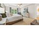 Comfortable bedroom features a trey ceiling, natural light, and neutral decor at 2761 Honey Locust Court, Loganville, GA 30052