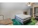 Bedroom featuring a ceiling fan, a window and a bed; ready to be transformed into a cozy retreat at 75 The Farm Rd, Mcdonough, GA 30252