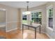 Bright breakfast nook featuring large windows that provide natural light and views of the backyard at 75 The Farm Rd, Mcdonough, GA 30252