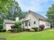 Inviting home with vinyl siding, a two-car garage, and a spacious yard at 75 The Farm Rd, Mcdonough, GA 30252