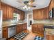 Traditional kitchen featuring warm wood cabinets, granite countertops, and stainless steel appliances at 75 The Farm Rd, Mcdonough, GA 30252