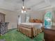 Spacious main bedroom features a tray ceiling, ceiling fan and two windows providing ample natural light at 75 The Farm Rd, Mcdonough, GA 30252
