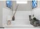 This relaxing bathroom features a soaking tub, white tiled walls, and contemporary decor at 924 Bryson Lake Cir, Douglasville, GA 30134
