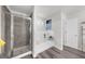 This is a relaxing bathroom featuring a tiled shower, soaking tub, and modern fixtures at 924 Bryson Lake Cir, Douglasville, GA 30134
