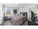 This cozy bedroom features a queen bed, neutral colors, and an accent chair to complete the comfortable space at 924 Bryson Lake Cir, Douglasville, GA 30134
