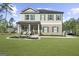 Lovely two-story home showcasing brick accents, a covered porch, and professionally landscaped front yard at 924 Bryson Lake Cir, Douglasville, GA 30134