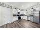 Well-lit kitchen boasts stainless steel appliances, white cabinetry, and granite countertops at 924 Bryson Lake Cir, Douglasville, GA 30134