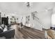 Open-concept living room showcasing hardwood floors, modern decor, and seamless flow throughout the space at 924 Bryson Lake Cir, Douglasville, GA 30134