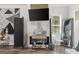 Stylish living room with fireplace, television, modern furniture, and decorative screen at 924 Bryson Lake Cir, Douglasville, GA 30134