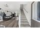 Spacious open-concept living room with modern decor, stylish furniture, and an abundance of natural light at 924 Bryson Lake Cir, Douglasville, GA 30134