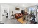 Comfortable living room with leather sofa, warm tones, and natural decor elements at 924 Bryson Lake Cir, Douglasville, GA 30134
