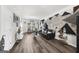 Bright living room featuring modern decor, wood flooring, and large windows at 924 Bryson Lake Cir, Douglasville, GA 30134