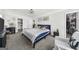 This cozy main bedroom features bright windows, a queen bed, and neutral colors, with carpet flooring at 924 Bryson Lake Cir, Douglasville, GA 30134