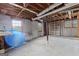 Unfinished basement space, ready for customization, with exposed ceiling and natural light from the windows at 3727 Calmer Cir, East Point, GA 30344