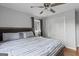 Bedroom featuring hardwood floors, ceiling fan, closet, neutral paint and a window with natural light at 3727 Calmer Cir, East Point, GA 30344