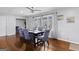Charming dining room with hardwood floors, designer chairs, and abundant natural light creating an inviting atmosphere at 3727 Calmer Cir, East Point, GA 30344