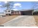 Charming two-story home with a long driveway and a convenient attached carport, offering comfort and functionality at 3727 Calmer Cir, East Point, GA 30344