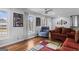 Cozy living room with hardwood floors, light gray walls, and bright windows create a warm and inviting atmosphere at 3727 Calmer Cir, East Point, GA 30344