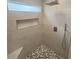 Modern bathroom features sleek shower with stone accents and tiled walls at 100 Little Creek Dr, Sharpsburg, GA 30277