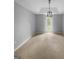 Neutral bedroom with carpet floors, a modern light fixture and a bright window at 100 Little Creek Dr, Sharpsburg, GA 30277