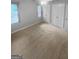 Spacious bedroom featuring a ceiling fan, window, carpet and double closets at 100 Little Creek Dr, Sharpsburg, GA 30277