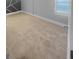 Neutral-toned bedroom featuring carpet, a window with natural light, and a unique accent wall design at 100 Little Creek Dr, Sharpsburg, GA 30277