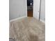 Neutral bedroom with carpet, gray walls, white trim and an open door leading to another room at 100 Little Creek Dr, Sharpsburg, GA 30277