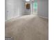 A spacious bedroom with a ceiling fan, a window and neutral paint and carpet at 100 Little Creek Dr, Sharpsburg, GA 30277