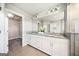 Bathroom with double sink vanity, granite countertop, and a large mirror at 1341 Rosen Rd, Brookhaven, GA 30319