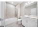 Bathroom featuring a white vanity, toilet, and bathtub with tiled walls at 1341 Rosen Rd, Brookhaven, GA 30319