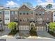 Charming brick townhome featuring an attached garage, well maintained landscaping, and stylish curb appeal at 1341 Rosen Rd, Brookhaven, GA 30319