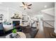 Open-concept living area featuring a fireplace, sleek furnishings, and seamless flow into the kitchen and dining at 1341 Rosen Rd, Brookhaven, GA 30319