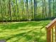 Lush backyard with mature trees and ample space for outdoor activities at 149 Wimberly Way, Powder Springs, GA 30127