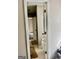 Clean bathroom with tiled flooring, sink and toilet, viewed through the doorway at 149 Wimberly Way, Powder Springs, GA 30127