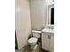 Bathroom features a new toilet and vanity with updated faucet and fixtures at 149 Wimberly Way, Powder Springs, GA 30127