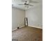 A corner bedroom with a ceiling fan and a floor mirror, perfect for relaxing or getting ready at 149 Wimberly Way, Powder Springs, GA 30127